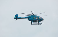 N507CC - The crew of 7CC, an MD-600N, was spotted inspecting electrical power transmission lines in Ft. Walton Beach, Fla. Sep 28, 2010. (an f-stop 5.6 photo) - by Bill Thornton, Former managing Editor, USAF Flying Safety Magazine