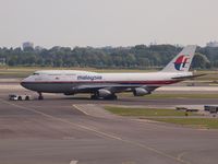 9M-MPK @ EHAM - Push back for take off - by Willem Goebel