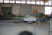 SE-DXT @ ESOW - De Havilland Vampire T55, ex Swiss Air Force, in Swedish air Force scheme in the Västerås aircraft museum. It is registered with the Eskilstuna aircraft museum. Not airworthy at this moment. - by Henk van Capelle