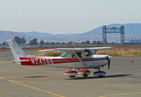 N24266 @ KAPC - Bridgeford FS 1977 Cessa 152 taxiing in with Napa River RR bridge in background - by Steve Nation