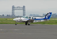 N874AN @ KAPC - IFTA/International Flight Training Academy (ANA Japan Airlines) 1993 Beech 58 in from KBFL (Meadows Field/Bakersfield, CA) with Napa River RR bridge in background - by Steve Nation
