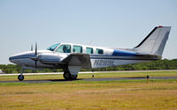N2119L @ KLNC - Baron on the ramp during Lancaster Open House '10. - by TorchBCT