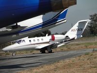 N573CM @ ONT - Parked on the southside behind several other jets - by Helicopterfriend