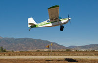 N613AP @ L67 - Banner pickup Runway 6. - by Marty Kusch