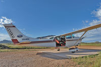 VH-HEX - Shot of aviation photographer Jon Davison in VH-HEX, on location at Wilpena Pound, South Australia October 2010. - by Alexis Bachofen
