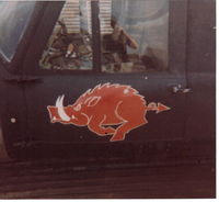 62-4567 - Here is the co-pilot's door with our Razorback insignia.  Look closely and you'll see a few schrapnel dings where the paint is chipped off.  This happened on 8 DEC 70.  The bad guys almost got me.