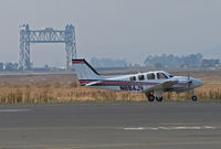 N894JV @ KAPC - Framed by the historic Napa River RR Bridge this former JAL 2009 Hawker Beechcraft G58 taxis back to IASCO ramp after one of last training flights for the Japanese airline - by Steve Nation