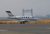 N952SP @ KAPC - Framed by the Napa River RR Bridge, Scannell Citation Inc (Indianapolis, IN) 2008 Hawker Beechcraft Corp 390 taxis out for flight to KHHR (Hawthorne, CA) - by Steve Nation
