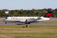 N8775A @ ORF - Delta Connection (Pinnacle Airlines) N8775A (FLT FLG4369) taxiing to RWY 23 via Taxiway Charlie for departure to Detroit Metro Wayne County Airport (KDTW).