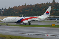 9M-MXA @ KBFI - New color scheme seen displayed on this 737-8H6 for Malaysia Airlines. - by Joe G. Walker