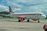 9M-AFJ @ WBKK - Air Asia Special Livery A320 at Kota Kinabalu - by Terry Fletcher