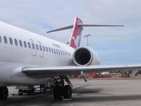 VH-NXH @ BME - B717 waiting for pax to board - by Henk Geerlings