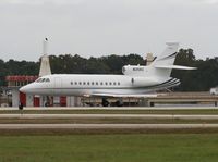 N35RZ @ ORL - Falcon 900 with a bald eagle sitting on the VOR - by Florida Metal