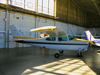 N6594Y @ KCMA - Home-based 1981 Cessna T210N rests in hanger at Camarillo Airport, CA on sunny, warm Jan day (now registered to owner in Arizona and in new blue/white colors) - by Steve Nation