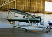 N6653K @ KCMA - float-equipped 1953 DHC-2 in hanger at Camarillo Airport, CA on sunny, warm Jan day - by Steve Nation