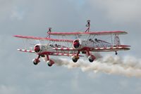 N707TJ @ EGFH - Team Guinot. N707TJ (trois/3) leading N74189 (deux/2) in a formation take off after displaying at the Wales National Airshow, Swansea Bay. - by Roger Winser