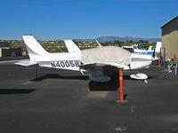 N40058 @ KCMA - Behind ubiquitous orange cone and under sunscreen cover lurks this 1977 Piper PA-28-161 at Camarillo Airport (CA) home base on sunny, balmy January day - by Steve Nation