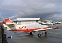 N1472J @ KSQL - Anticipating rain the owner of this 1977 Rockwell International 112B has her cockpit covered @ San Carlos, CA - by Steve Nation