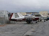 N8319E @ KSQL - 1959 Mooney M20A hiding under covers @ San Carlos, CA - by Steve Nation