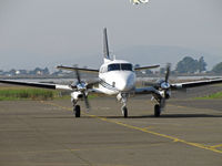 N444LR @ KAPC - Head-on shot of N444LR LLC (Malibu, CA) 1996 Beech C90A King Air arriving from KCMA/Camarillo, CA with Staggerwing N9115H climbing out in background - by Steve Nation