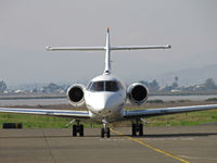N877QS @ KAPC - NetJets 2008 Hawker 900XP arriving from KLAS/McCarren Intl Airport, Las Vegas, NV - head on shot with Napa River in background - by Steve Nation