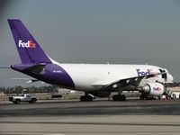 N411FE @ ONT - Parked east of the Fed Ex building - by Helicopterfriend