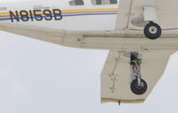N8159B @ KOSH - Left main tire is cut through in 6 o'clock position, caused by propeller from another aircrfat while on approach to Oshkosh, aircraft ran off runway on landing, other aircraft landed safely. - by Todd Royer