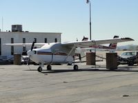 N2542S @ CCB - Tied down, covered up and parked in Foothill Sales & Service - by Helicopterfriend