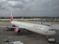 N845MH @ EGCC - Delta B-767 in Breast Cancer Awareness Colours at Manchester International UK.Taken from inside the terminal building
