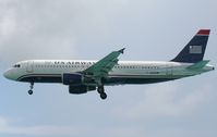 N102UW @ TNCM - Us airways landing at TNCM