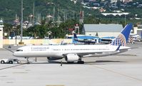 N21108 @ TNCM - Continental N21108 being push back from the gates at TNCM