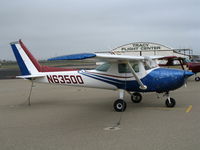 N63500 @ KTCY - 1975 Cessna 150M @ framed by Tracy Flight Center hangar at Tracy Municipal Airport, CA home base - by Steve Nation