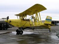N7509Y - Testing spraybars on Tolle's Flying Service (Robbins, CA) 1992 G-164B-20T between flights at owner's private airstrip near junction of State Hwy 113 and Reclamation Road - applying liquid fertilizer to wheat this day with spray bars - by Steve Nation