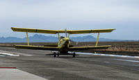 N36265 - Tolle's Flying Service (Robbins, CA) 1983 turbine G-164B returns from application run to owner's private airstrip near junction of State Hwy 113 and Reclamation Road - applying dry fertilizer to wheat this day with spreader (Sutter Buttes in background) - by Steve Nation