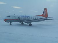 C-FAGI @ CYEV - Air North (Yukon's Airline) HS 748 departing Inuvik, NT 2010 Nov 16.  Apologies for the glare from the interior lighting at the airport.  It's not a picture-friendly facility.