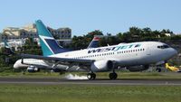 C-GWSU @ TNCM - WestJet C-GWSU landing at TNCM