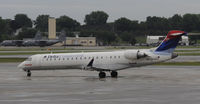 N656CA @ KMSP - Stormy day at MSP - by Todd Royer