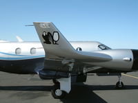 N942TW @ KHWD - Close-up of eagle and wineglass logos on wingtip airfoil on 2005 Pilatus PC-12/45 @ Hayward, CA - by Steve Nation