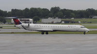 N909XJ @ KMSP - Stormy day in MSP - by Todd Royer
