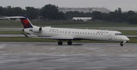 N695CA @ KMSP - Stormy day in MSP - by Todd Royer