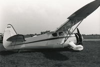 N88WT @ KDPA - Ex-N88WT, US Navy NH-1 29457.  B&W photo, taken a couple days after the mishap, for publishing in Air Classics Magazine, January 1984. - by Glenn E. Chatfield