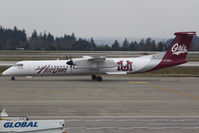 N402QX @ KSEA - Seen in the colors of the University of Montana Grizzlies, is this Horizon Air Q400. - by Joe G. Walker