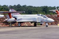 153088 @ KNPA - A bit fuzzy, photographed from a moving bus.  Shot down a MiG-17 on 6/11/72.  Displayed here at the National Museum of Naval Aviation before being repainted and sent to New York