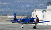 N465DC @ CNO - Taxiing between the hangers heading to runway 26L - by Helicopterfriend