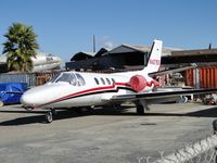 N427SS @ CNO - Covered up and parked in the paint shop fenced area - by Helicopterfriend