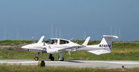 N240TS @ KSQL - Utah State University 2005 Diamond DA-42 beginning take-off roll @ San Carlos, CA - by Steve Nation