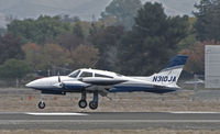 N310JA @ KCCR - Johnson Ranch (Bigfork, MT) 1978 Cessna T310R on touchdown to RWY 32R (in from KGOO/Nevada County Air Park, Grass Valley, CA) @ Buchanan Field, Concord, CA - by Steve Nation