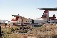 N7027J - Ex USCG Mobile 1265. Taken in 1978 or 1979.  Outside of DM. - by Jim Hellinger