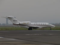 N986QS @ KAPC - NetJets 1999 Cessna 750 taxis past Napa River RR Bridge for departure to KSMF (Sacramento Metro Airport, CA) @ Napa County Airport, CA - by Steve Nation