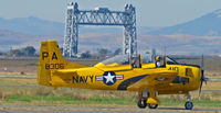 N306WW @ KAPC - Napa River RR Bridge in background frames this shot of 1955 T-28B BuAer 138306 in yellow US Navy training scheme marked as PA-410 and NX306WW taxis for take-off at Napa County Airport, CA home base - by Steve Nation